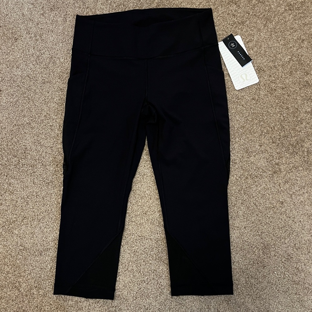 Black Lululemon capris with mesh panels